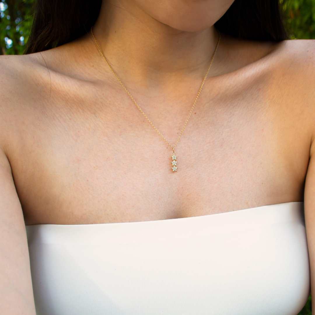 Woman wearing the 3 Star Diamond Necklace