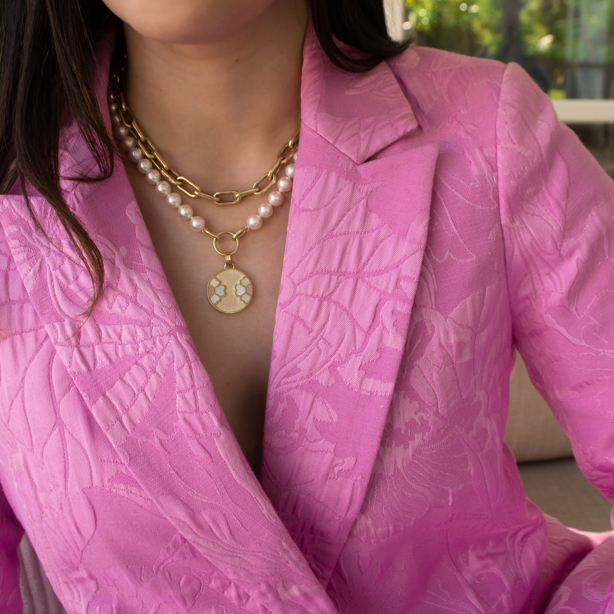 Woman wearing the 7-7.5mm Akoya Pearl Necklace with the Diptyph Floral Medallion and the Barbara Choker