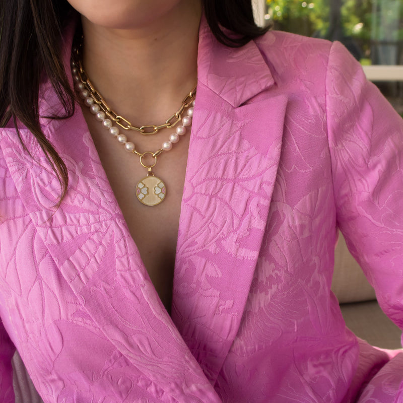 Woman wearing the 7-7.5mm Akoya Pearl Necklace with the Diptyph Floral Medallion and the Barbara Choker