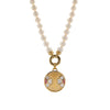 7-7.5mm Akoya Pearl Necklace with the Diptyph Floral Medallion: Pearl necklace with a gold clasp attached to a medallion with a flower design on a white background
