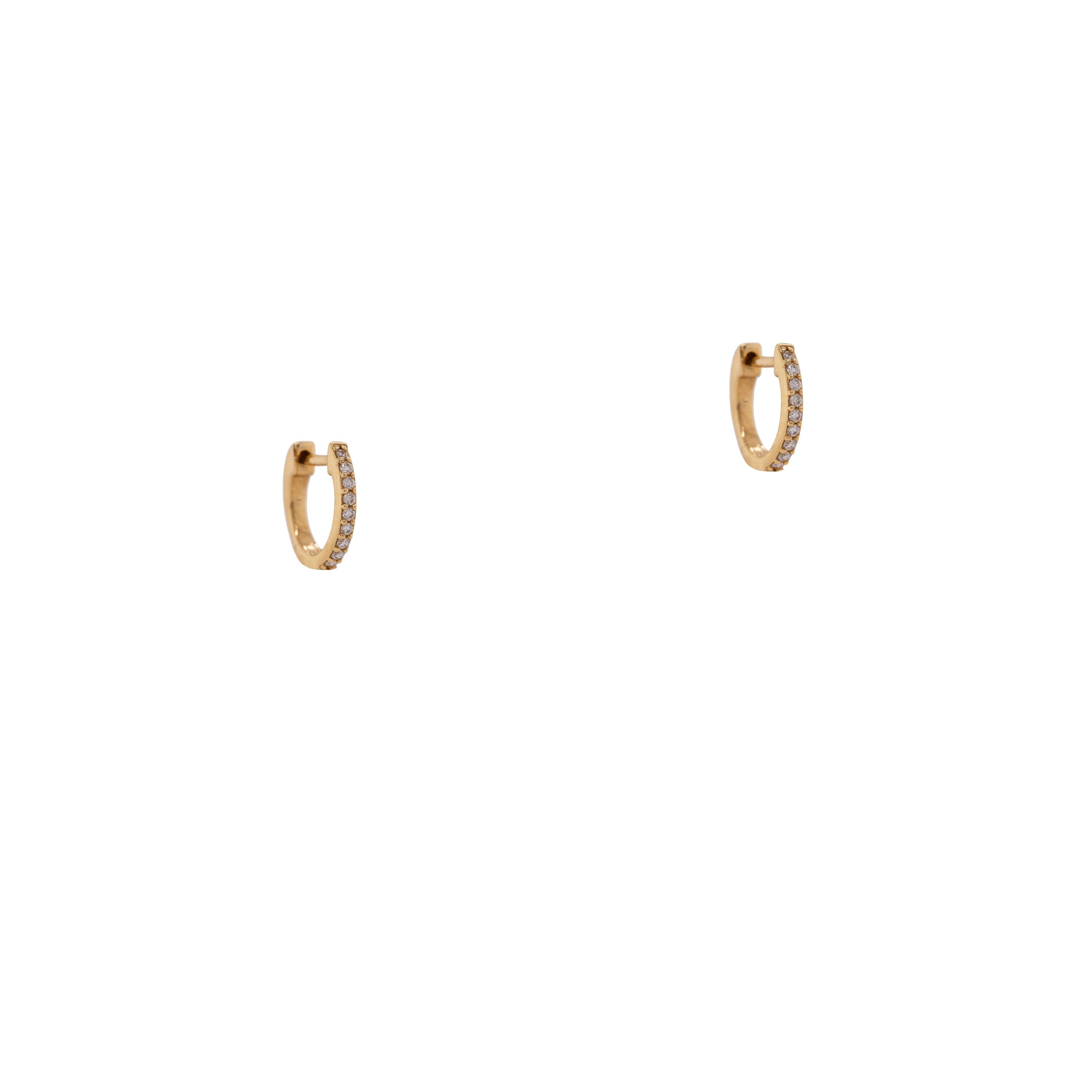 9mm Oval Diamond Huggies: 14K gold 9mm oval huggie earrings on a white background