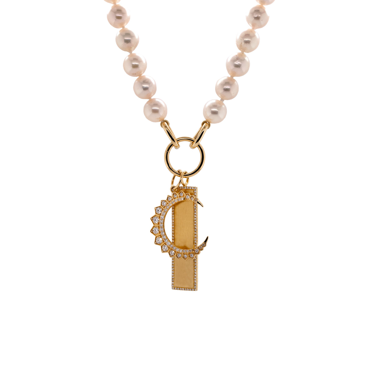 An Akoya Pearl necklace with Large Diamond crescent pendant and a white diamond dog tag pendant in 14K yellow gold.