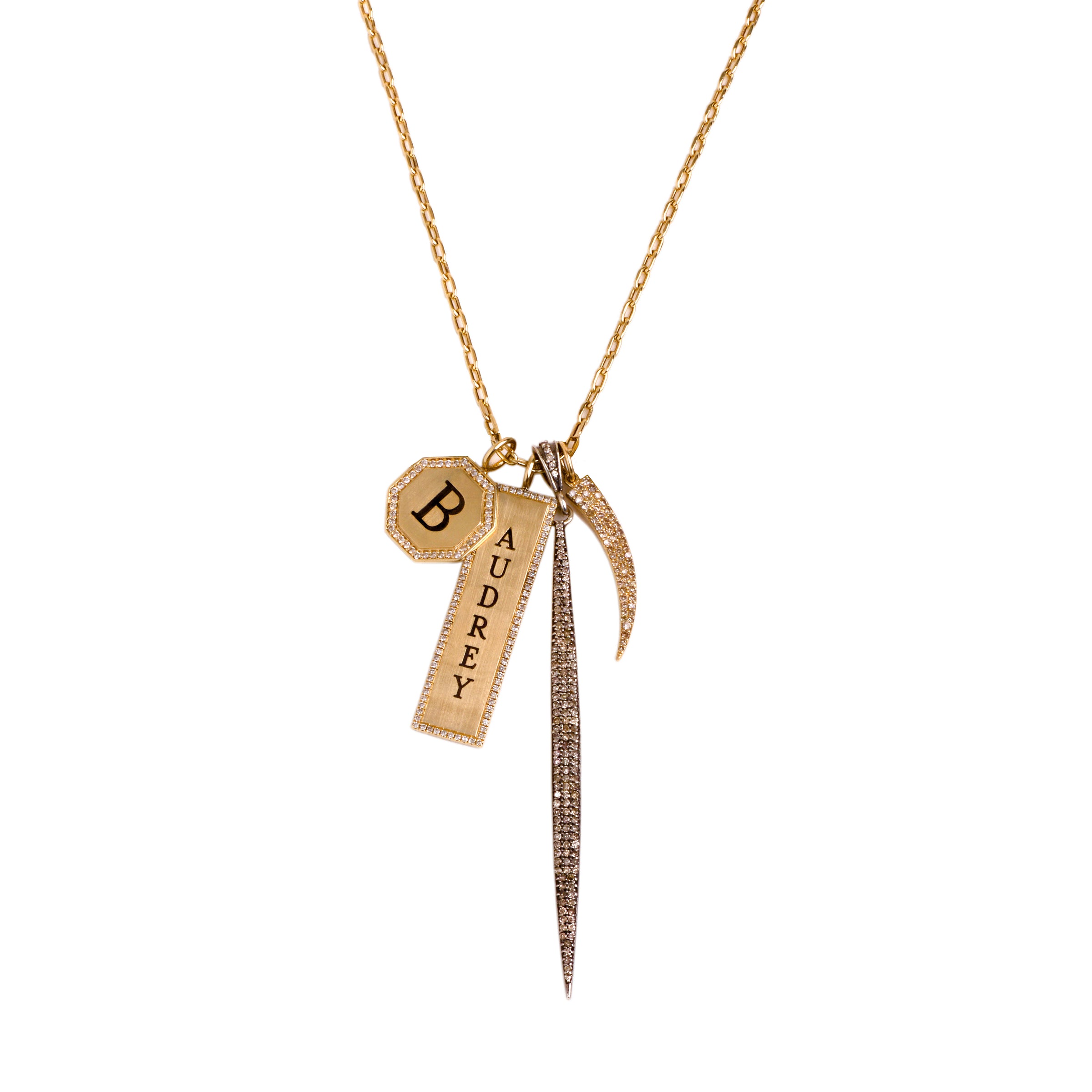 Audrey Charm Necklace: A 14K yellow gold charm necklace with a long link chain and four charms, including the Octagon Diamond Pendant, the Dog Tag Pendant w/ Diamonds, the Silver 3" Champagne Diamond Spear, and the  Diamond Tusk 