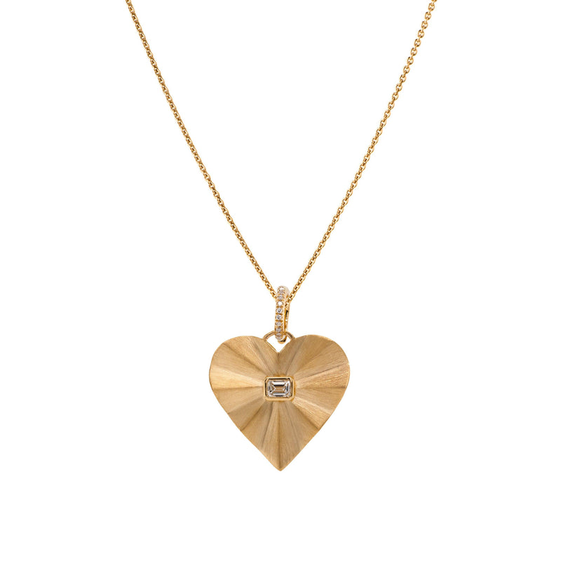 Bezel Spiral Heart Necklace: A 14K gold pendant in the shape of a heart with a diamond in the center on a chain