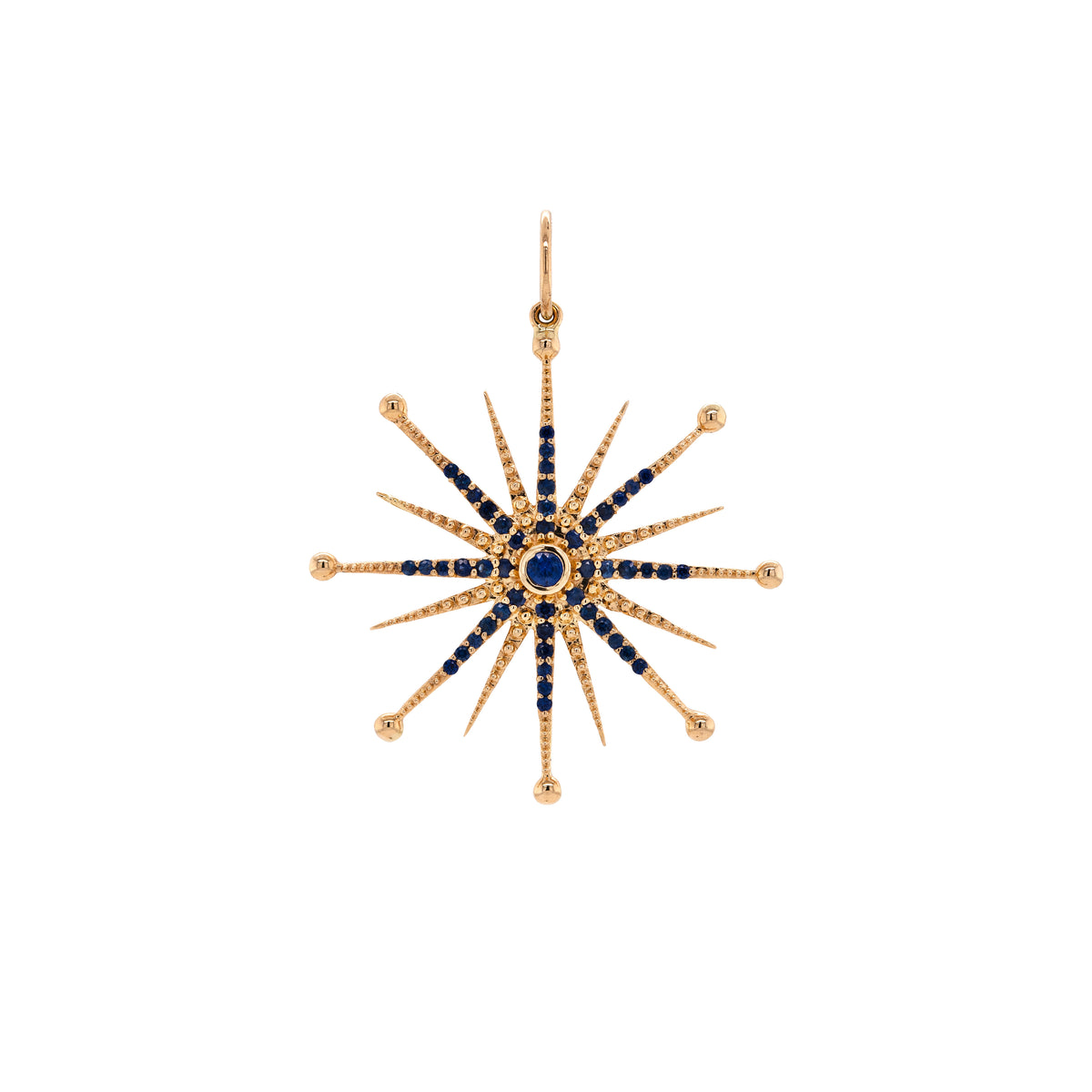 Blue Sapphire Nebula Pendant: A 14K gold blue sapphire pendant in the shape of a star with multiple blue sapphire stones set within a yellow gold frame.