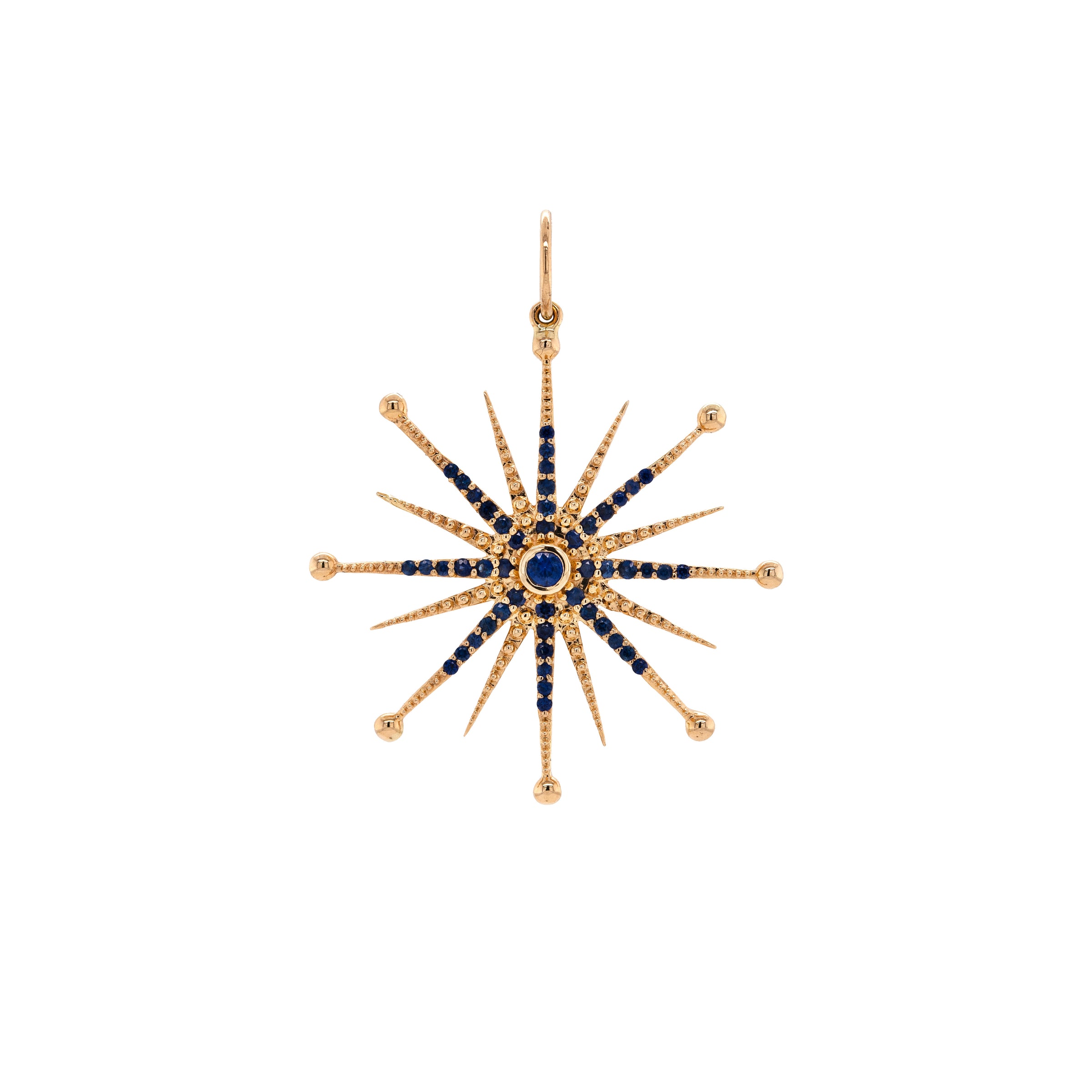 Blue Sapphire Nebula Pendant: A 14K gold blue sapphire pendant in the shape of a star with multiple blue sapphire stones set within a yellow gold frame.