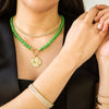 Woman wearing the Burmese Jade Necklace with the Garden Medallion, and the Gaga Diamond Necklace.