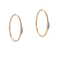 Diamond Cluster Hoops: a pair of 14K gold hoop earrings with diamond clusters, featuring an endless closure.
