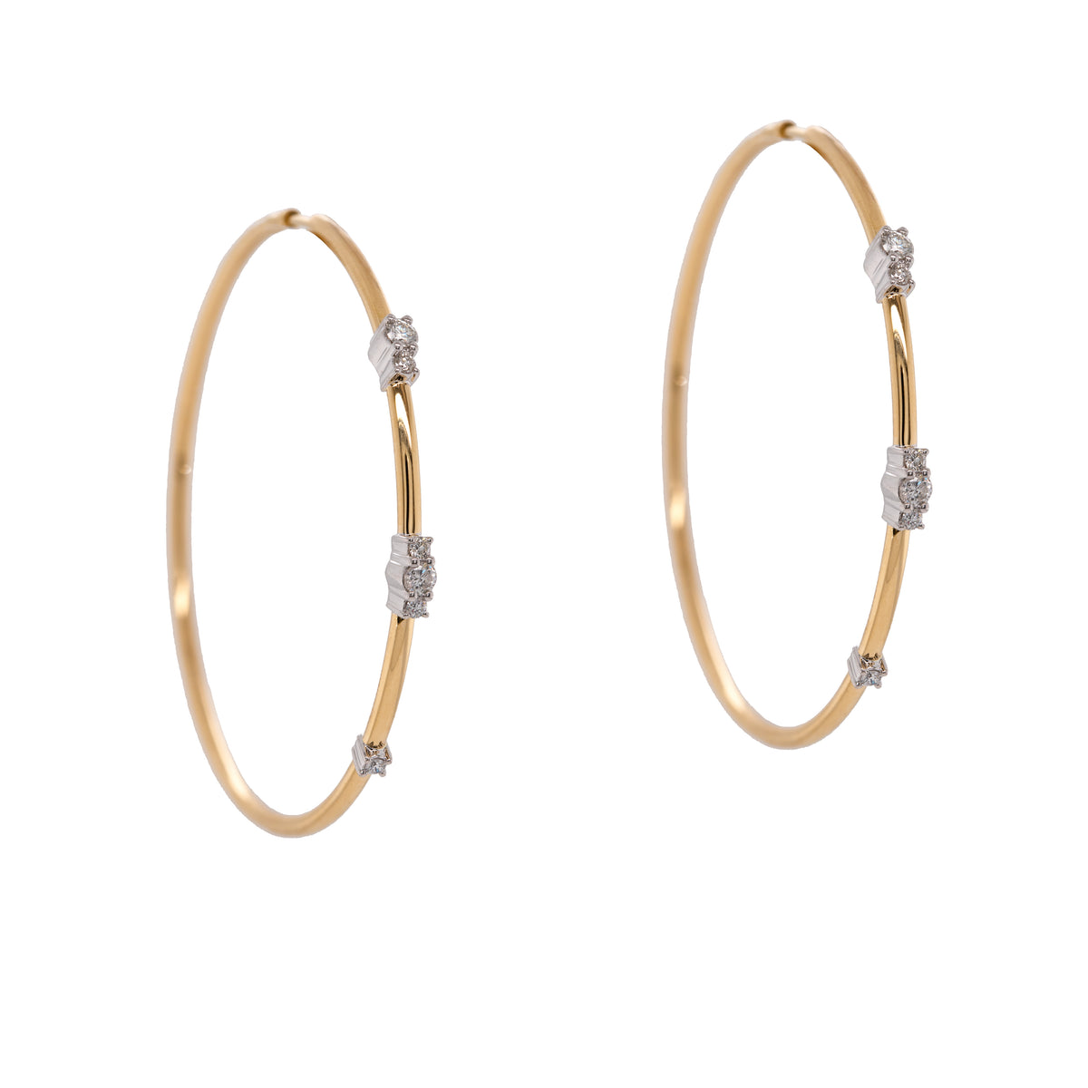 Diamond Endless Hoops: a pair of 14K gold hoop earrings with diamond clusters, featuring an endless closure.
