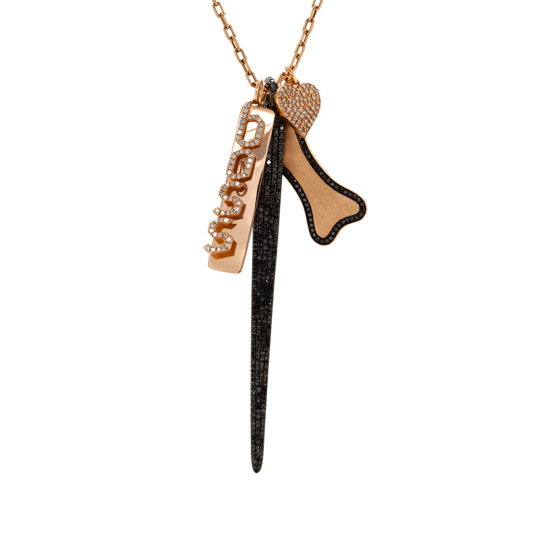A 14K gold charm necklace with a long link chain and five charms: Diamond Heart Pendant, Dog Tag Pendant, Black Diamond Spear, Large Diamond Dog Bone Pendant w/ Black Diamonds, Boss Pendant 