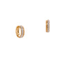 A pair of 14K gold diamond row huggies with hinged hoops on a white background.