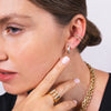 Close up of women wearing the Diamond Row Huggies, Open Bar Diamond Ear Cuff, and the the letter "m"  Alphabet Diamond Signet Ring