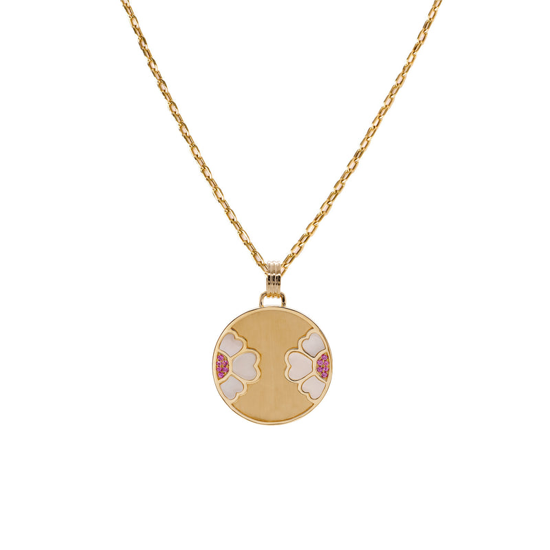 Diptyph Floral Medallion Necklace: 14K gold necklace with a medallion with a flower design on a white background