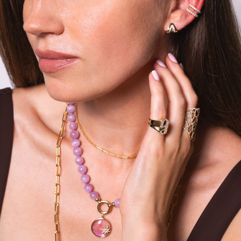 Women wearing the Double Arrow Studs, Open Bar Diamond Ear Cuff, the letter "g" Alphabet Signet Ring and Flora Ring.