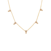 Double Dot Necklace: A 14K yellow gold chain necklace with a lobster clasp fastening, featuring a series of double round diamond charms.