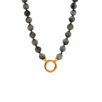 Eagle Eye Necklace, necklace with gray beads and a gold clasp on a white background