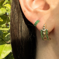 close up of ear wearing the Emerald Double Prism Rock Huggies
