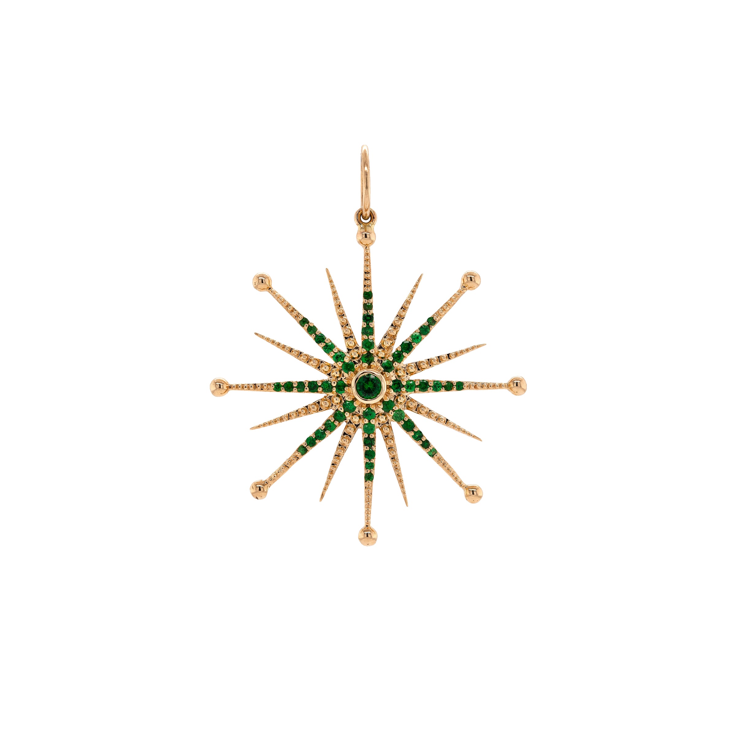 Emerald Nebula Pendant: A 14K gold emerald pendant with a star-shaped design, featuring multiple emeralds set in a yellow gold frame.