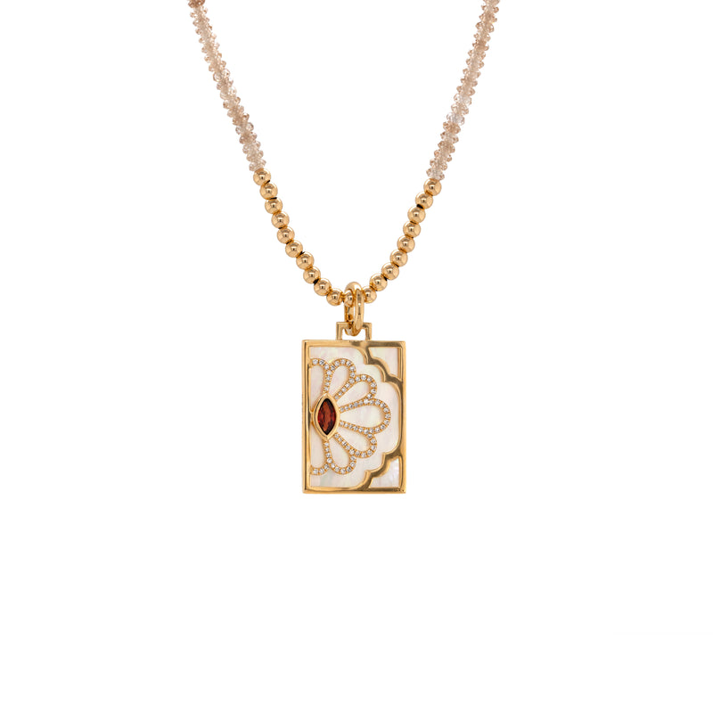 Garnet Floral Evil Eye Dog Tag, 14K Gold necklace with a rectangular pendant featuring a red gemstone on a white background