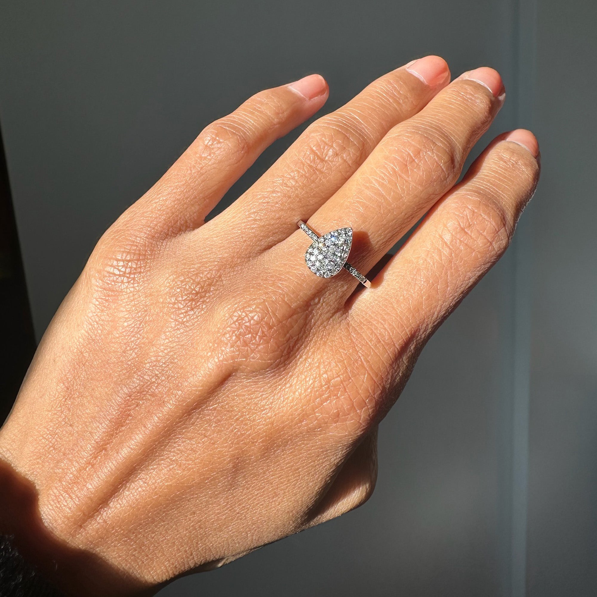 Hand wearing the Diamond Teardrop Ring w/ Gray Diamonds