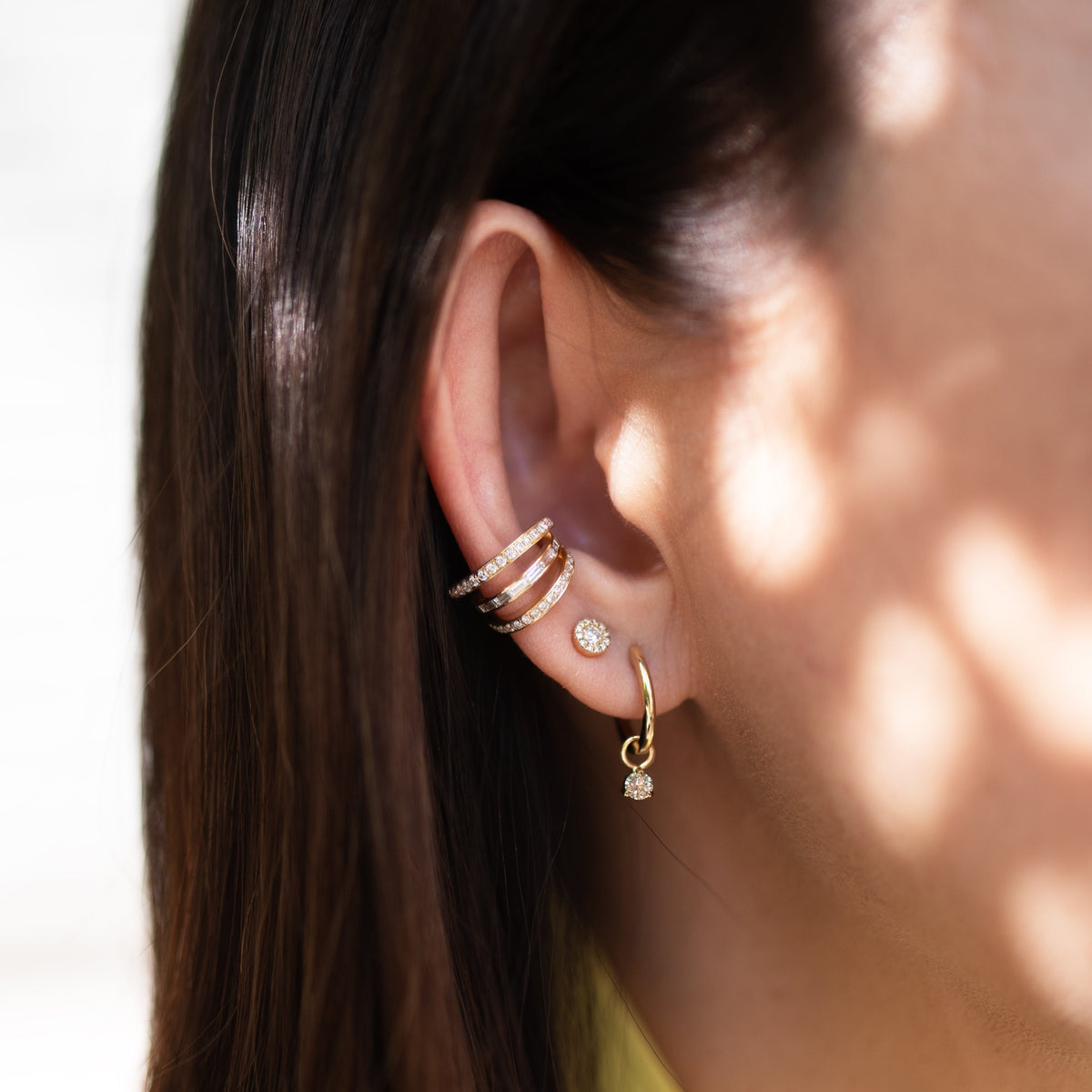 Women wearing the Illusion Round Studs and the Deco Diamond Ear Cuffs
