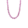 Kunzite Necklace: A necklace with purple pink round beads and gold beads, featuring a gold ring clasp.