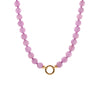 Kunzite Necklace: A necklace with purple pink round beads and gold beads, featuring a gold ring clasp.