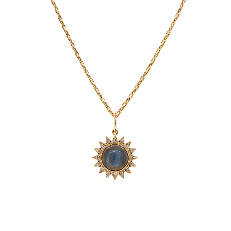 Labradorite Sunburst Necklace: A gold necklace with a sunburst pendant featuring a labradorite stone in the center, surrounded by small diamonds.