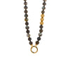 Labradorite with Gold Beads Necklace: A necklace with round labradorite beads, 3 gold beads, and a gold round charm clasp.