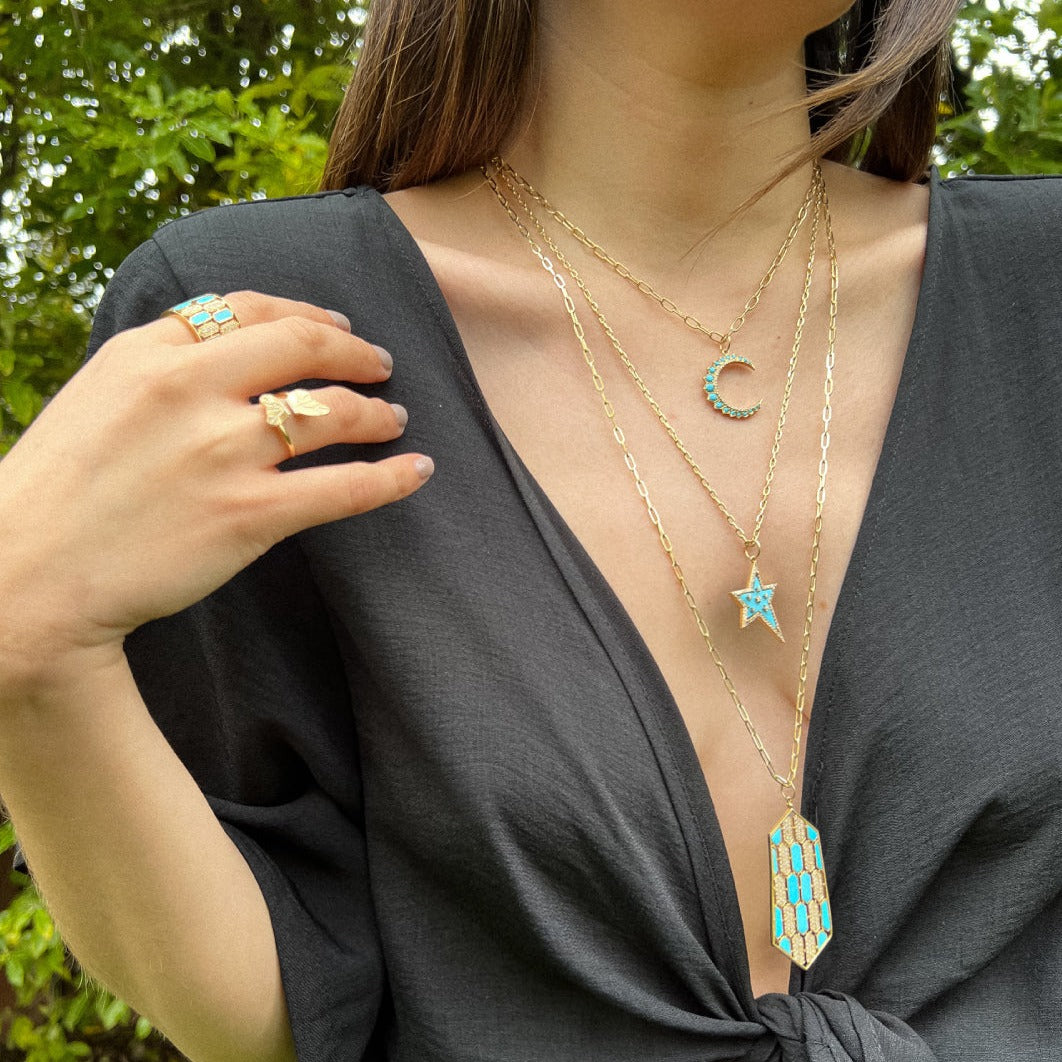 Woman wearing the Large Turquoise Mosaic Necklace, the Turquoise Shooting Star Necklace, the Large Turquoise Crescent  Necklace