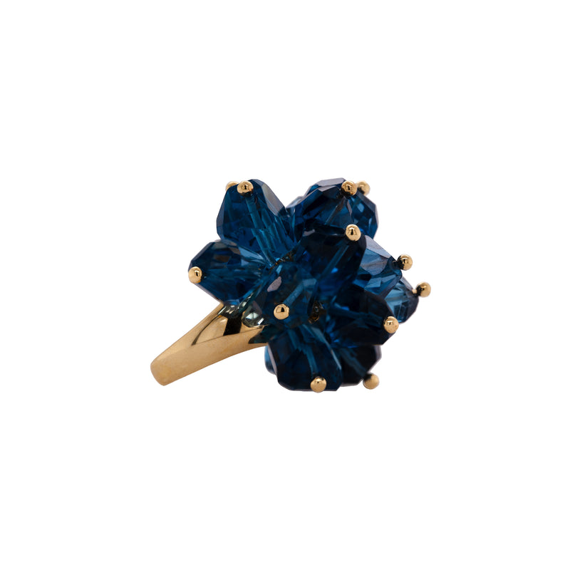 London Blue Topaz Pom Pom Ring: A 14K gold ring featuring a cluster of large London Blue Topaz gemstones made into a floral pattern
