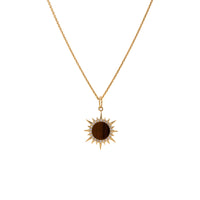 Mini Tiger's Eye Solstice Necklace: A 14K gold pendant featuring a Tiger's Eye gemstone surrounded by round diamonds on a chain.