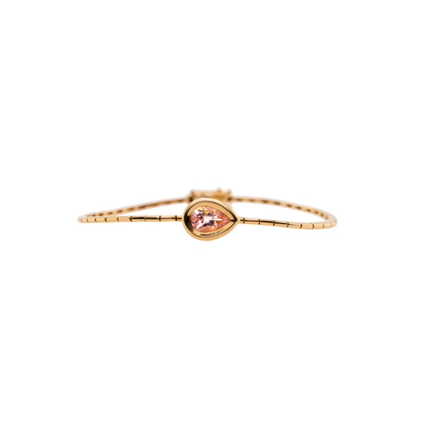 Morganite Liquid Teardrop Bracelet, 14K gold bracelet with a teardrop shaped pink gemstone on a white background