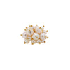 Pearl Pom Pom Ring: A gold ring with a cluster of white pearls on it, set against a white background.