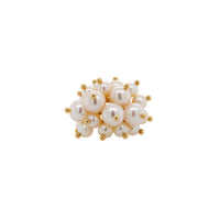Pearl Pom Pom Ring: A gold ring with a cluster of white pearls on it, set against a white background.