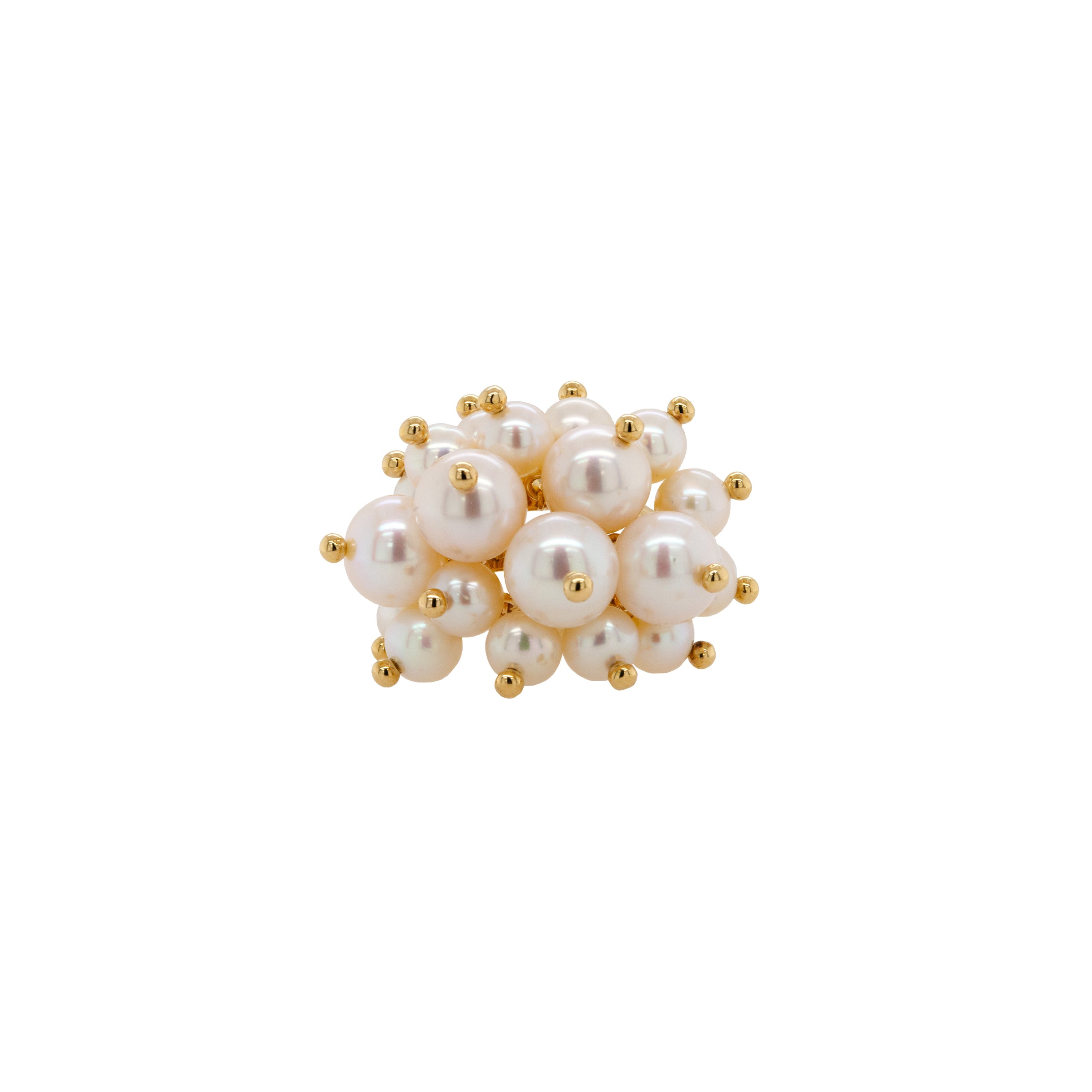 Pearl Pom Pom Ring: A gold ring with a cluster of white pearls on it, set against a white background.