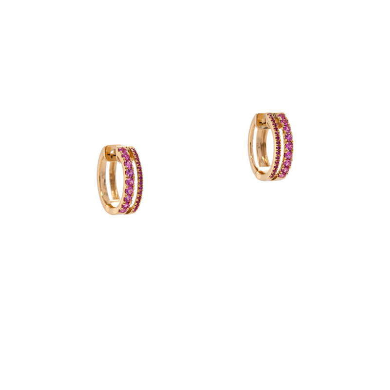 Pink Sapphire Chloe Huggies: 14K gold huggie earrings with pink gemstones on a white background