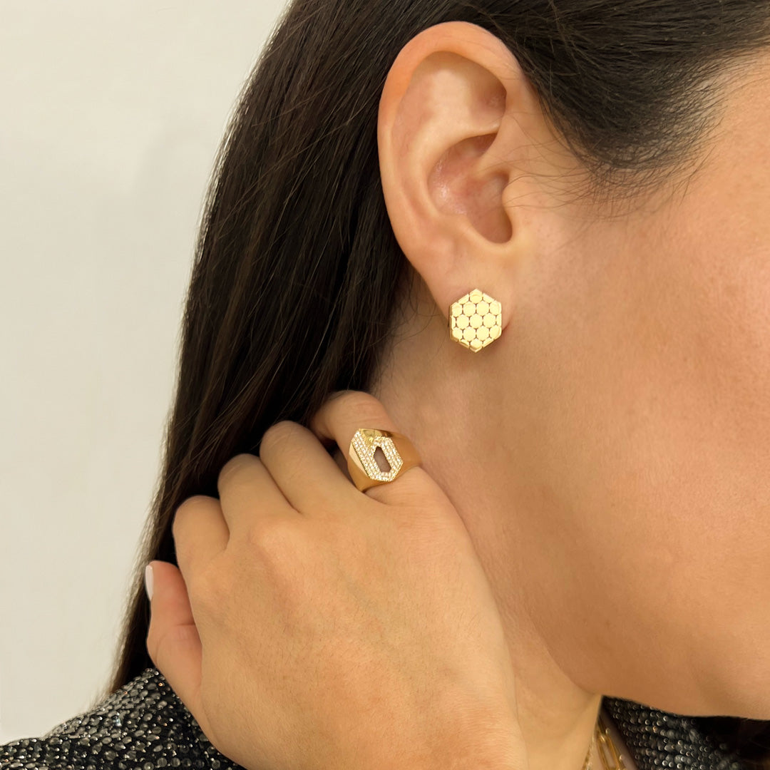 Close up of woman wearing the Prism Clip Earrings, the "b" Alphabet Signet Ring