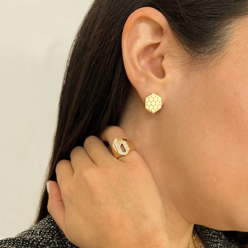 Close up of woman wearing the Prism Clip Earrings, the "b" Alphabet Signet Ring