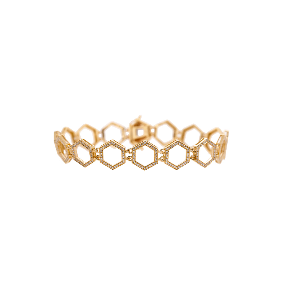 Prism Tennis Bracelet: A 14K gold bracelet with a geometric pattern, featuring a series of linked diamond prism-shaped links, on a white background.