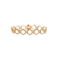 Prism Tennis Bracelet: A 14K gold bracelet with a geometric pattern, featuring a series of linked diamond prism-shaped links, on a white background.
