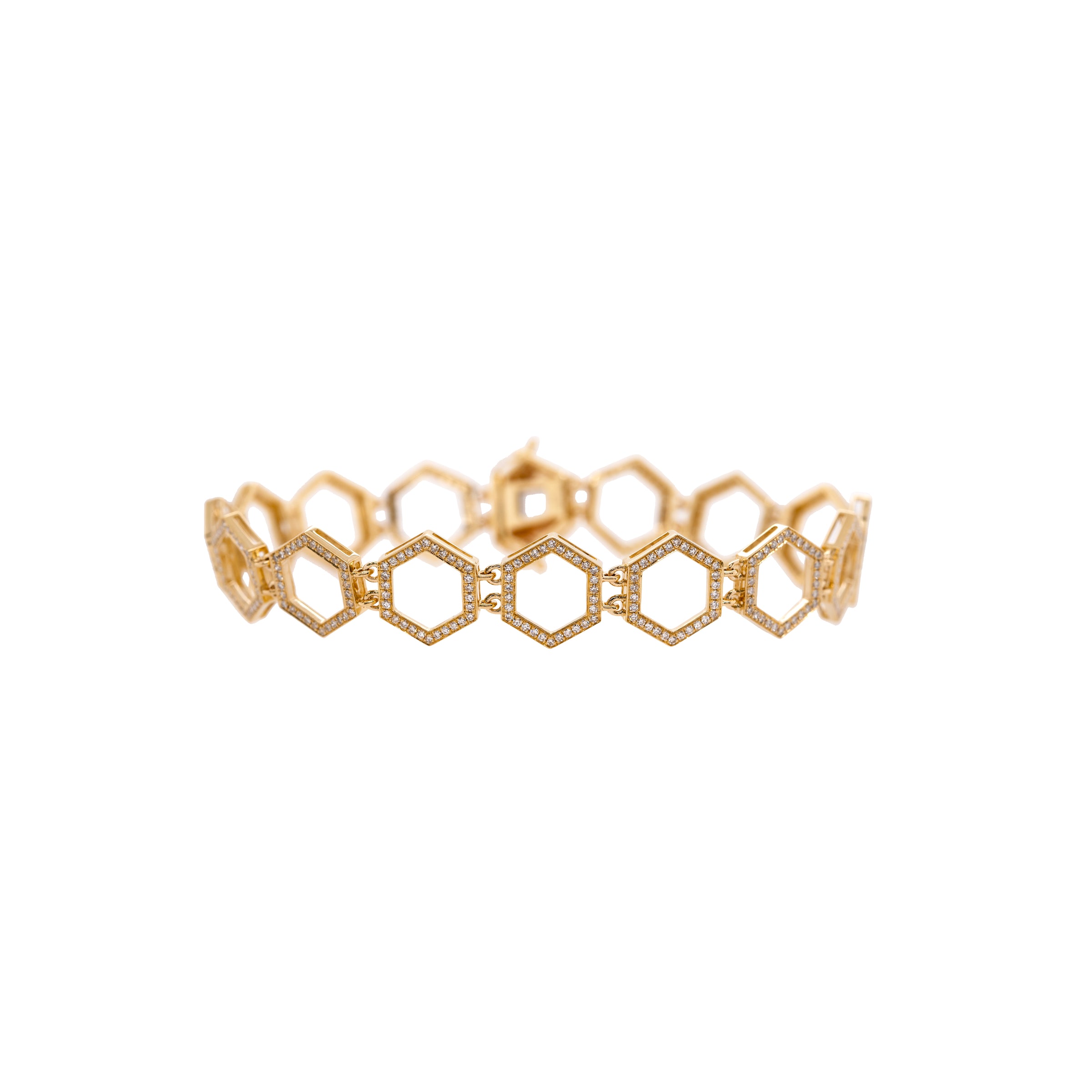 Prism Tennis Bracelet: A 14K gold bracelet with a geometric pattern, featuring a series of linked diamond prism-shaped links, on a white background.