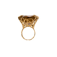 Rutilated Cocktail Ring: A 14K gold cocktail ring featuring a large rutilated quartz centerpiece with a yellow band.