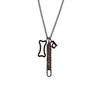 A silver charm necklace with a round link chain and three charms, including a Long Baguette Diamond Charm Clasp, a Small Black Diamond Alphabet Pendant, and a Small Hollow Black Diamond Dog Bone Pendant.