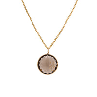 Smoky Quartz Crystal Galaxy Necklace: A round smoky quartz crystal pendant featuring a small diamond star on the bottom right corner. with a gold yellow gold chain 