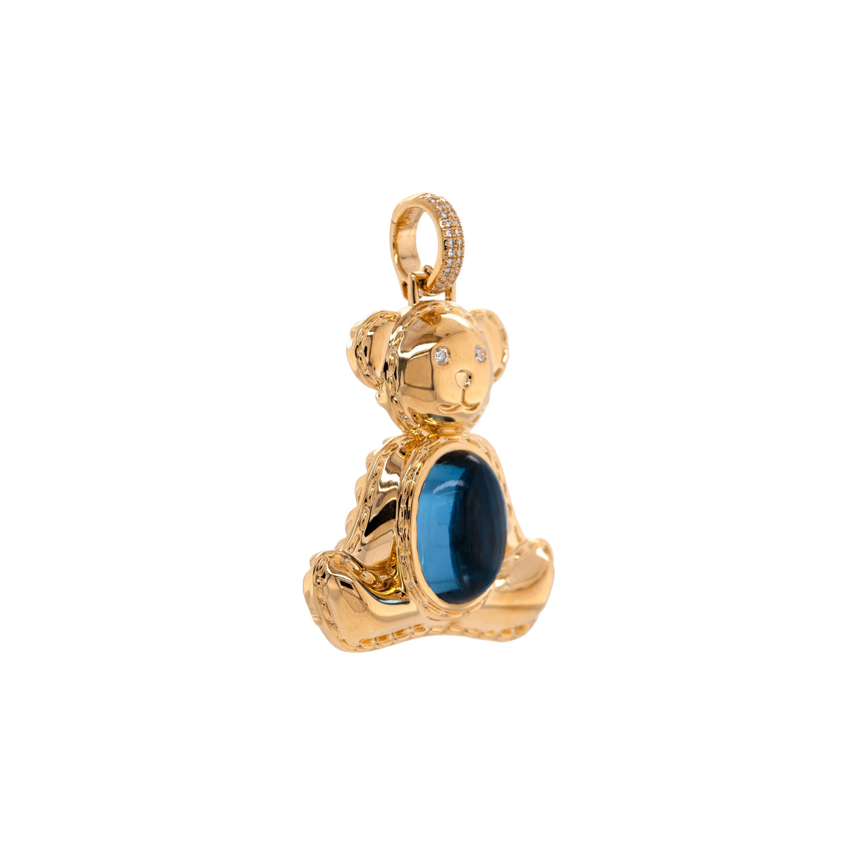 side view of 14K gold bear-shaped pendant, Teddy Pendant, featuring a London Blue Topaz gemstone on a white background