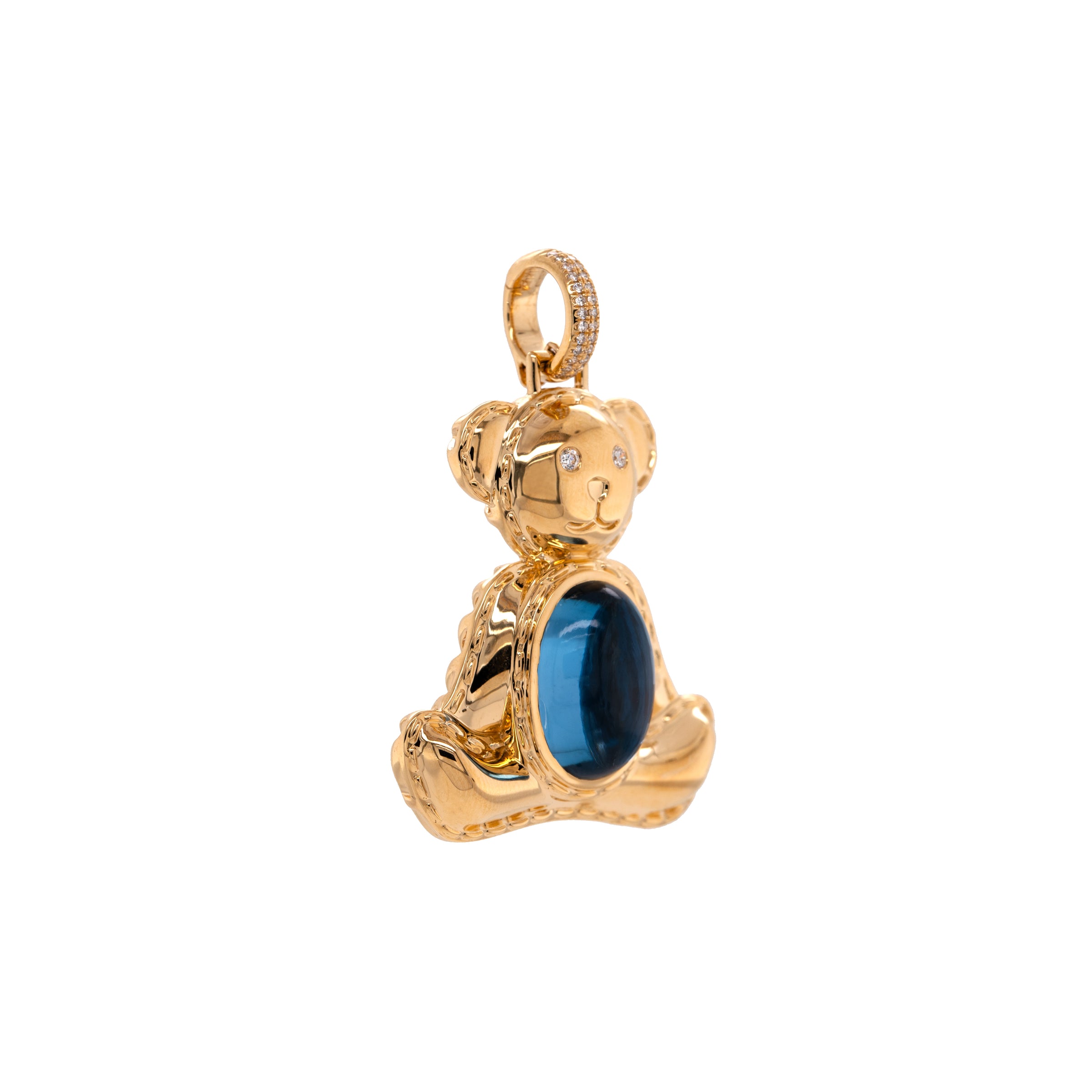 side view of 14K gold bear-shaped pendant, Teddy Pendant, featuring a London Blue Topaz gemstone on a white background