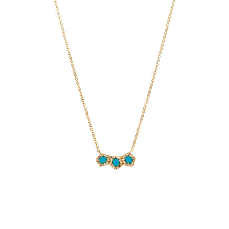 Turquoise Prism Bar Necklace: 14K gold necklace with turquoise hexagon-shaped stones outlined by diamonds on a gold chain against a white background