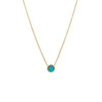 Turquoise Round Necklace: 14K Gold necklace with a round turquoise pendant outlined by diamonds on a white background