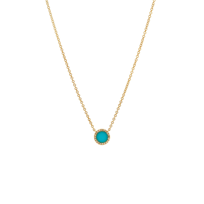Turquoise Round Necklace: 14K Gold necklace with a round turquoise pendant outlined by diamonds on a white background